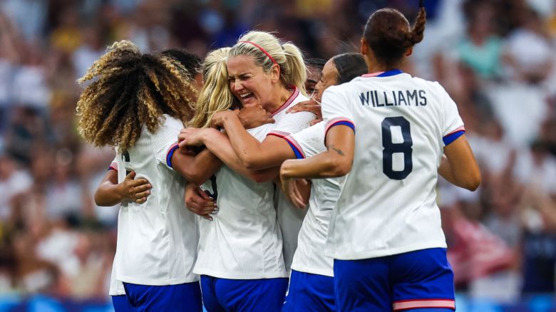 TOPSHOT - US' midfielder #03 Korbin Albert celebrates with teammates after scoring her team's second goal during the women's group B football match between Australia and the USA of the Paris 2024 Olympic Games at the Marseille Stadium in Marseille on July 31, 2024. (Photo by Pascal GUYOT / AFP) (Photo by PASCAL GUYOT/AFP via Getty Images)