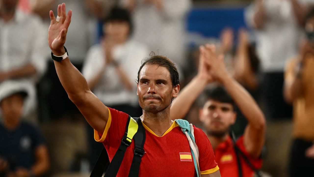 Spain's Rafael Nadal waves goodbye after he and Spain's Carlos Alcaraz lose to US' Austin Krajicek and US' Rajeev Ram in their men's doubles quarter-final tennis match on Court Philippe-Chatrier at the Roland-Garros Stadium during the Paris 2024 Olympic Games, in Paris on July 31, 2024.