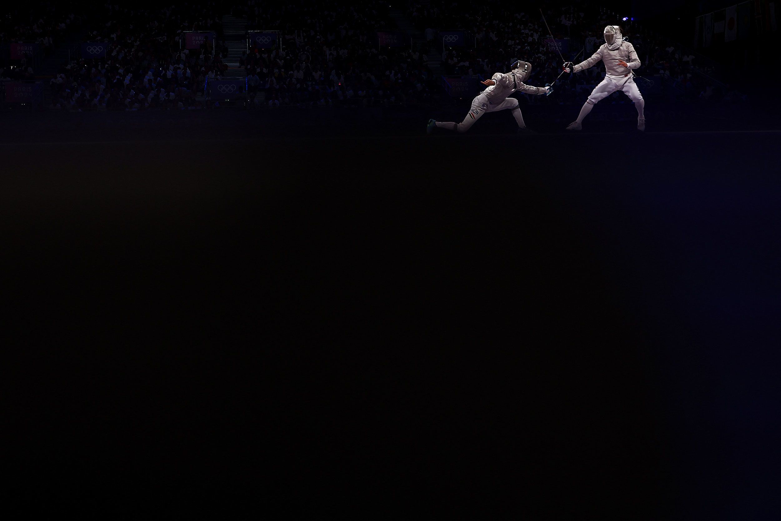 Hungarian fencer Krisztian Rabb, left, faces South Korea's Park Sang-won on July 31. South Korea won gold in the team sabre event.