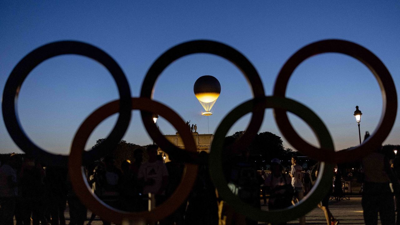 PARIS, FRANCE - JULY 28: PARIS, FRANCE - JULY 28: The Olympic cauldron is pictured trough Olympic rings as it stands high near Louvre Museum on day two of the Olympic Games Paris 2024 at  on July 28, 2024 in Paris, France. (Photo by Maja Hitij/Getty Images) (Photo by Maja Hitij/Getty Images)