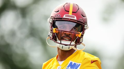 ASHBURN, VA - JULY 25: Jayden Daniels #5 of the Washington Commanders attempts a pass during training camp at OrthoVirginia Training Center at Commanders Park on July 25, 2024 in Ashburn, Virginia. (Photo by Scott Taetsch/Getty Images)