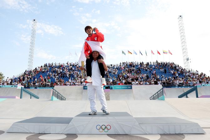 Japanese skateboarder Yuto Horigome celebrates with his gold medal after <a >winning the street competition</a> on July 29. Horigome also won the event at the Tokyo Olympics three years ago.