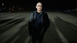 Former prisoner held by Russia, ex-US Marine Paul Whelan, stands on the tarmac as he arrives at Joint Base Andrews in Maryland on August 1, 2024. Journalist Evan Gershkovich and fellow prisoners released by Russia landed in the United States late August 1, an AFP journalist saw, as part of an extraordinary swap deal struck between Washington and Moscow. A plane carrying Gershkovich, former US marine Paul Whelan, and journalist Alsu Kurmasheva landed at around 11:40 pm (0340 GMT) at Joint Base Andrews near Washington, where President Joe Biden and Vice President Kamala Harris were waiting to greet them.