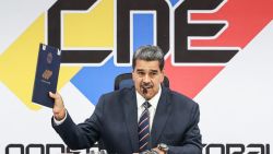 CARACAS, VENEZUELA - JULY 29: President-elect Nicolas Maduro (C) shows the certificate proclaiming him as the winner of the electoral battle during the ceremony to deliver the majority of the vote Certificate at CNE Headquarters on July 29, 2024 in Caracas, Venezuela. Incumbent president Maduro was announced as the winner of a controversial presidential election with 51,20% of the votes while opposition candidate Edmundo Gonzalez of the Plataforma Unitaria Democratica Coalition got 44,2% according to the 'Consejo Nacional Electoral CNE (National Electoral Council). (Photo by Jesus Vargas/Getty Images)