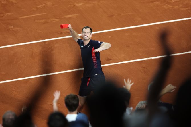 British tennis player Andy Murray throws his sweatband into the crowd after he and doubles partner Dan Evans <a href="https://www.cnn.com/sport/live-news/paris-olympics-news-2024-07-30#h_2282ca8d3cc57b451230e7eae1a6353f">advanced to the quarterfinals</a> with a dramatic win over Belgium's Sander Gille and Joran Vliegen on July 30. Murray and Evans won 6-3, 6-7, 11-9. Murray has said this tournament will be the last of his legendary career.