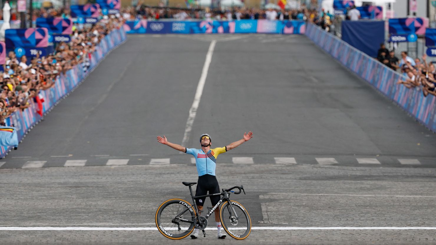 Belgium's Remco Evenepoel celebrates after crossing the finish line to win the men's cycling road race during the Paris 2024 Olympic Games in Paris on Saturday.