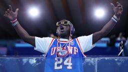 American rapper Flavor Flav shows his support during the Women's Preliminary Round Group B match between Team Italy and Team United States on day five of the Olympic Games Paris 2024 at Aquatics Centre on July 31, 2024, in Paris, France.