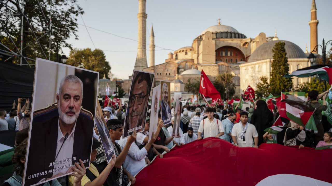 Pro-Palestinian demonstrators take part in a rally to condemn the assassination of Hamas leader Ismail Haniyeh, at Hagia Sophia Square in Istanbul, on August 3, 2024. Gathered at the call of several conservative and pro-government associations, thousands of demonstrators gathered to denounce the death of Hamas leader Ismail Haniyeh, after he was buried on August 2, 2024 in Qatar. Israel, accused by Hamas, Iran and others of the attack which killed the Hamas leader, has not directly commented on the assassination. (Photo by KEMAL ASLAN / AFP) (Photo by KEMAL ASLAN/AFP via Getty Images)