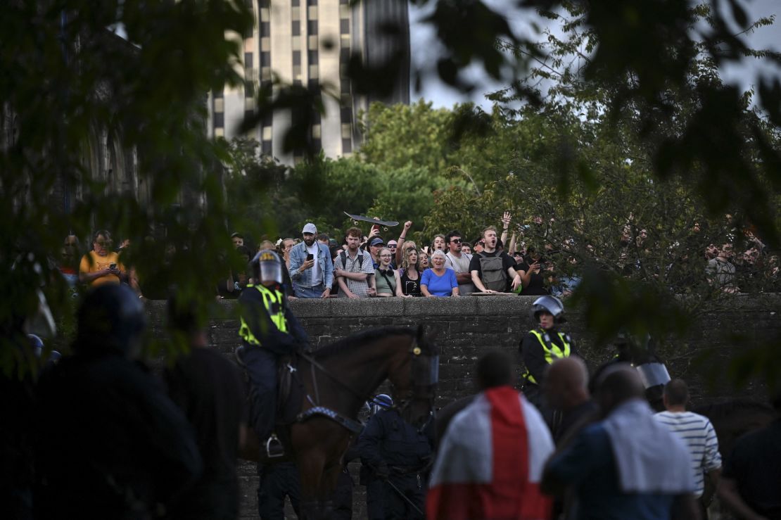 Anti-racism protesters gesture at people who had gathered for a far-right rally in Bristol.