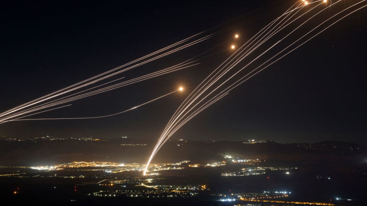 TOPSHOT - Rockets fired from southern Lebanon are intercepted by Israel's Iron Dome air defence system over the Upper Galilee region in northern Israel, on August 4, 2024, amid ongoing cross-border clashes between Israeli troops and Lebanon's Hezbollah fighters. Middle East tensions soared Saturday as Iran and its allies readied their response to the assassination of Hamas's political leader, blamed on Israel, spurring fears of a regional war. (Photo by Jalaa MAREY / AFP) (Photo by JALAA MAREY/AFP via Getty Images)