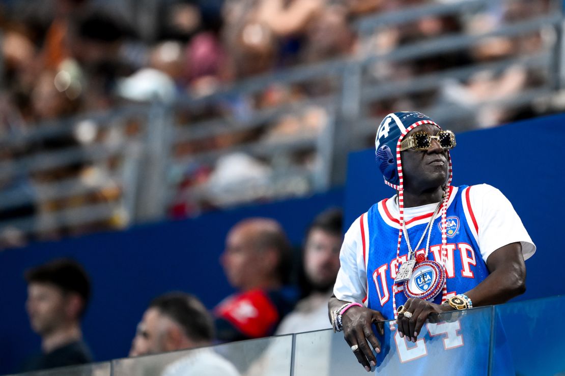 Flavor Flav watches the women's water polo match between team Italy team USA at the Paris Olympics on July 31.