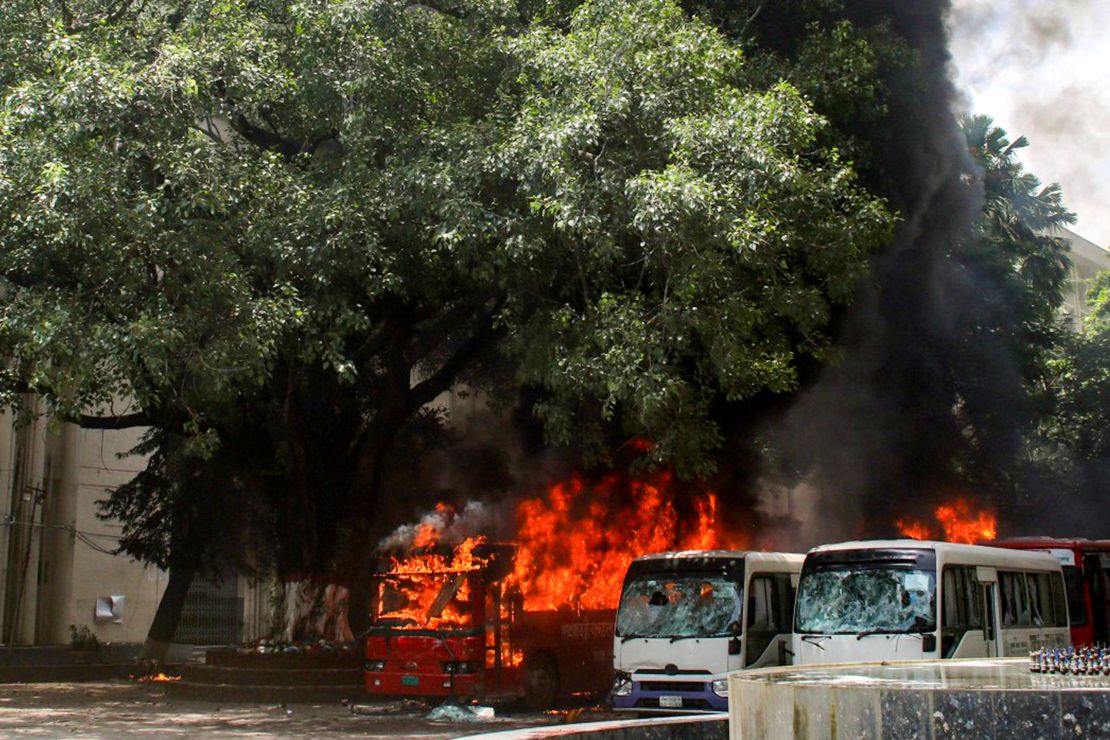 Buses were set on fire as students and government supporters clashed during a protest in Dhaka.