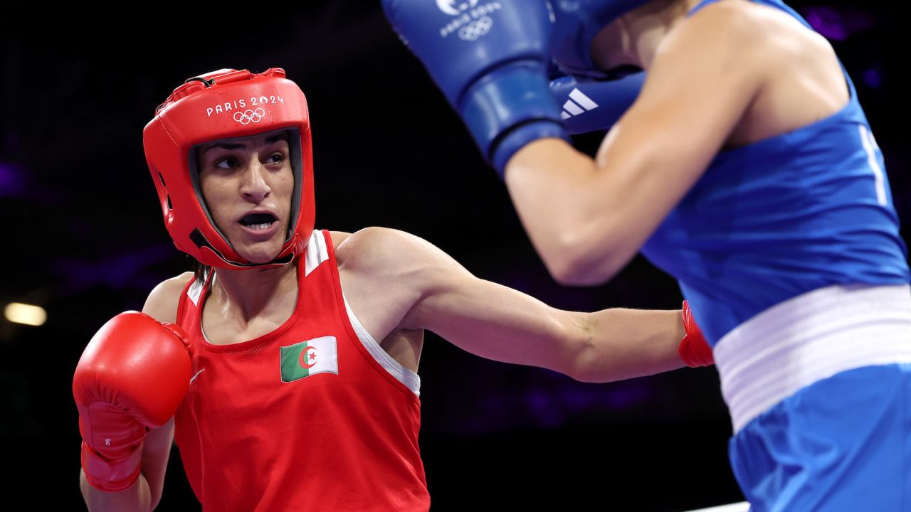 PARIS, FRANCE - AUGUST 01: Imane Khelif of Team Algeria punches Angela Carini of Team Italy during the Women's. 66kg preliminary round match on day six of the Olympic Games Paris 2024 at North Paris Arena on August 01, 2024 in Paris, France. (Photo by Richard Pelham/Getty Images)