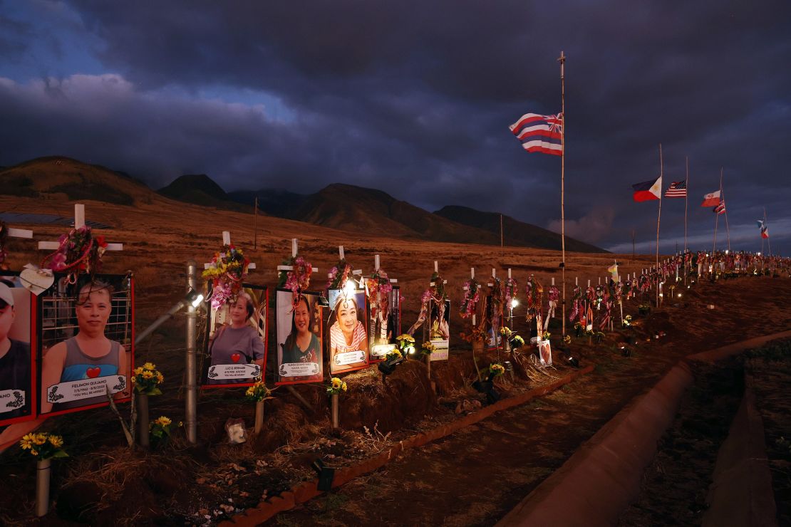 Pictures and crosses are displayed at a public hillside memorial to Lahaina wildfire victims on August 1, 2024 in Lahaina, Hawaii. August 8 marks the one-year anniversary of the Maui wildfires which killed 102 people and devastated the historic community of Lahaina in West Maui.