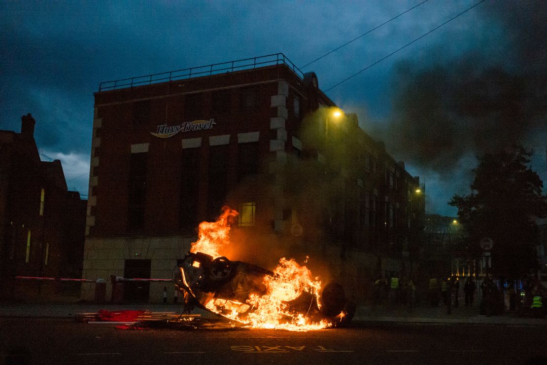 A police car is set on fire in Sunderland, England on August 2, 2024.