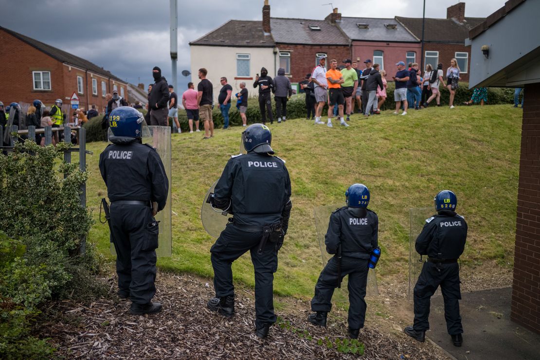 Riot police monitor a protest in Sunderland, England on August 2, 2024.