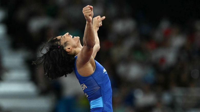 India's Vinesh Phogat reacts to beating Japan's Yui Susaki in their women's freestle 50kg wrestling early rounds match at the Champ-de-Mars Arena during the Paris 2024 Olympic Games, in Paris on August 6, 2024.