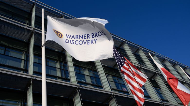 A Warner Bros. Discovery flag. The company will be split into two.