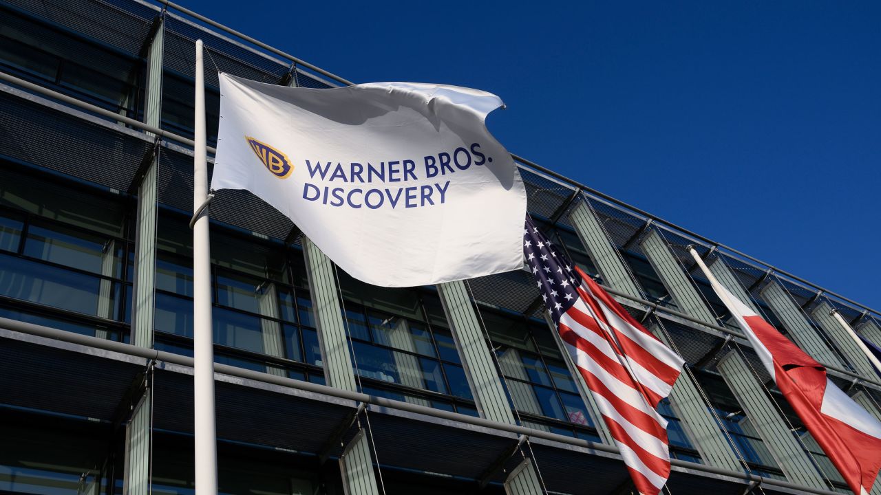 A Warner Bros. Discovery flag. The company will be split into two.