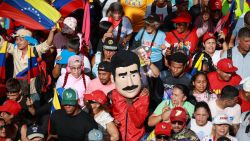 CARACAS, VENEZUELA - AUGUST 3: A pro-government supporter rallies with a mask representing President of Venezuela Nicolás Maduro during the 'Gran Marcha Nacional' on August 3, 2024 in Caracas, Venezuela. President Maduro was declared as the winner of the 2024 presidential election over his rival, Edmundo Gonzalez. The result has been questioned by the opposition and internationally. According to the opposition leader Maria Corina Machado, the result announced by the 'Consejo Nacional Electoral' (CNE) does not reflect the decision made by the Venezuelans during the election. (Photo by Jesus Vargas/Getty Images)