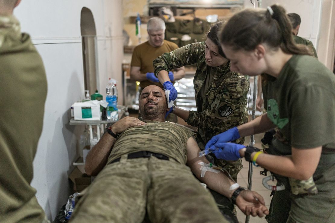 Ukrainian army medics treat wounded  soldiers at a stabilization point in the Pokrovsk direction.