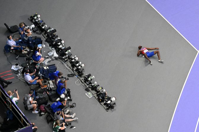 US sprinter Noah Lyles lies on the ground after the 200 meters. Lyles, who was diagnosed with Covid-19 earlier this week, <a >required assistance from medical personnel</a>. He said he was feeling light-headed after the race and that he also was experiencing chest pain and shortness of breath. He was later able to give television interviews.