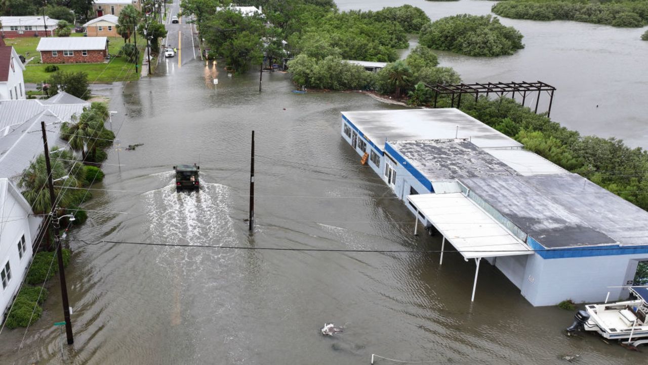 CEDAR KEY, FLORIDA - AUGUST 05: In an aerial view, a Florida National Guard vehicle drives through a flooded street from the rain and storm surge caused by Hurricane Debby on August 05, 2024, in Cedar Key, Florida. Hurricane Debby brings rain storms and high winds along Florida’s Big Bend area. (Photo by Joe Raedle/Getty Images)
