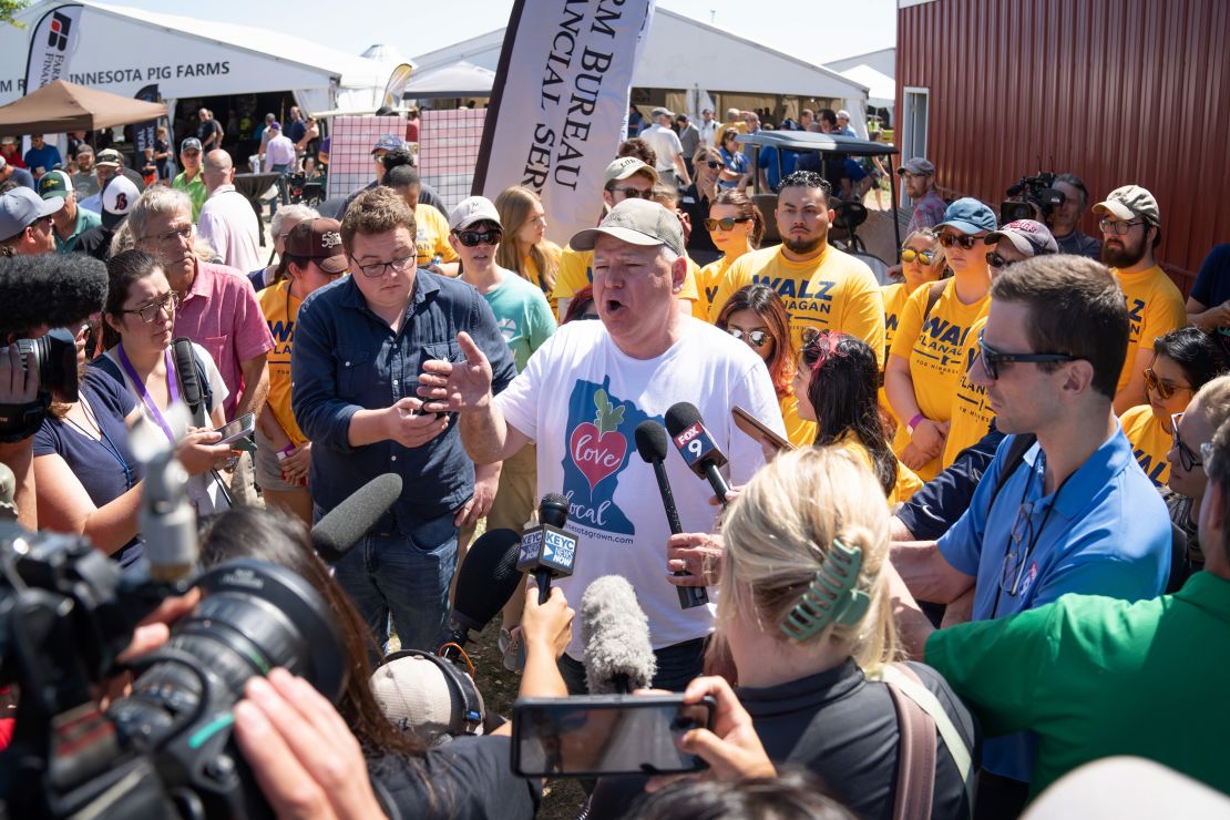 Tim Walz speaks to media after the FarmFest agricultural forum in Morgan, Minnesota, on August 3, 2022.