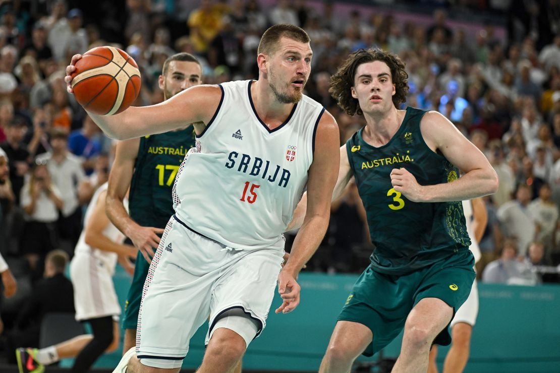 Nikola Jokic of Serbia in action with Josh Giddey of Australia during the Men's Basketball Quarterfinal match between Serbia and Australia.