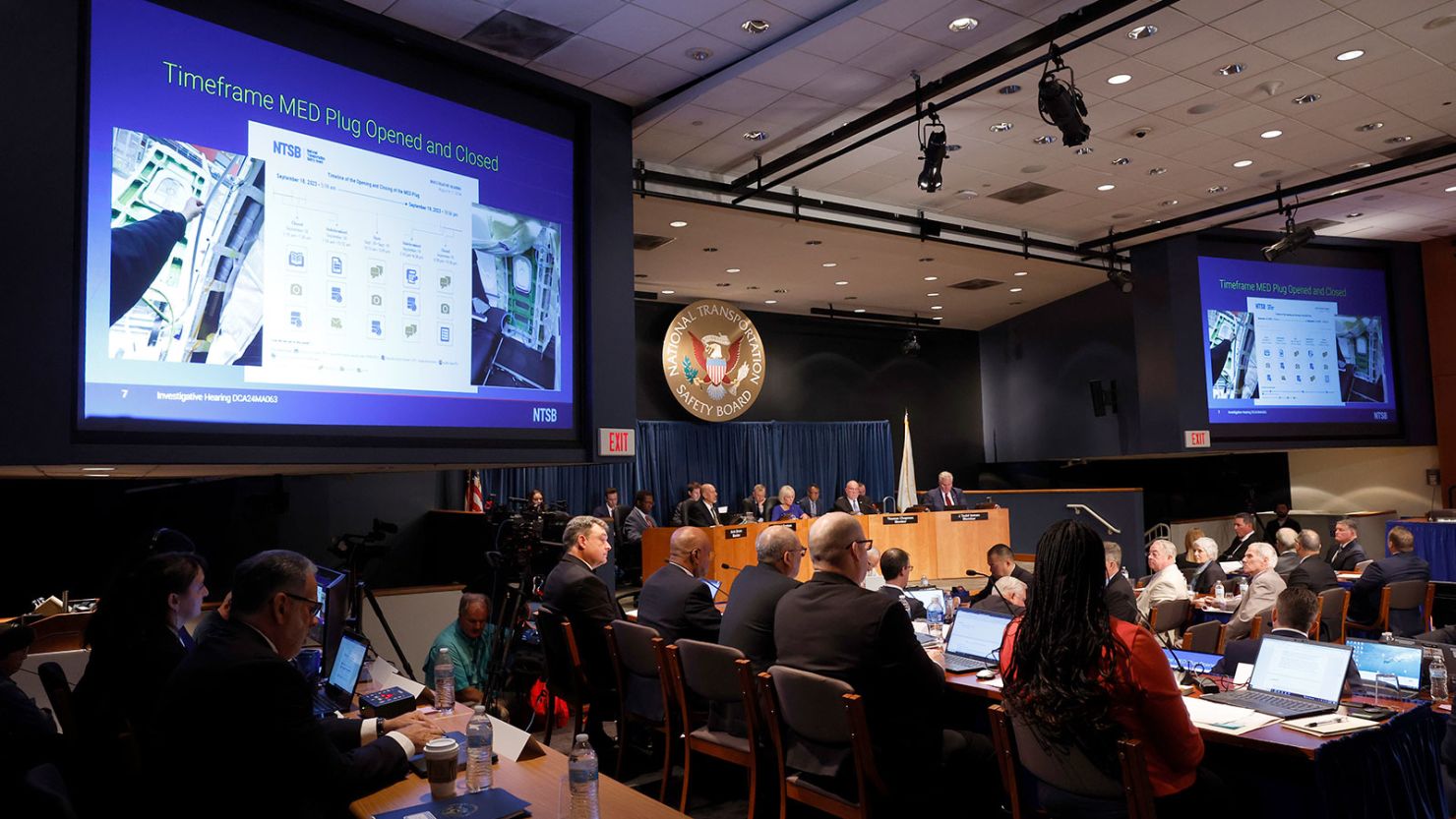 A visual aid displays the steps of production of the door plug that blew off from an Alaska Airlines flight in January, leaving a gaping hole in the side of a Boeing 737 Max. The National Transportation Safety Board held the first of two days of hearings into the incident on Tuesday.