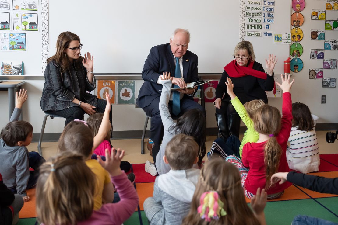 ST. PAUL, MN. - JANUARY 2023: Minnesota DFL (Democratic-Farmer-Labor Party) Governor Tim Walz, along with Lt. Gov. Peggy Flanagan(left) and First Lady Gwen Walz(right), read The Day You Began by Jacqueline Woodson, illustrated by Rafael López, to a group of kindergarteners at Adams Spanish Immersion Elementary, St. Paul, Minn., Tuesday, January 17, 2023. The governor started his budget release by talking about education and kid-focused spending at the school. (Photo by Glen Stubbe/Star Tribune via Getty Images)