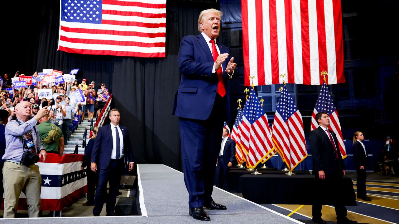 Republican presidential nominee, former President Donald Trump walks toward the stage to speak at a rally at the Brick Breeden Fieldhouse at Montana State University in Bozeman, Montana on August 9, 2024.