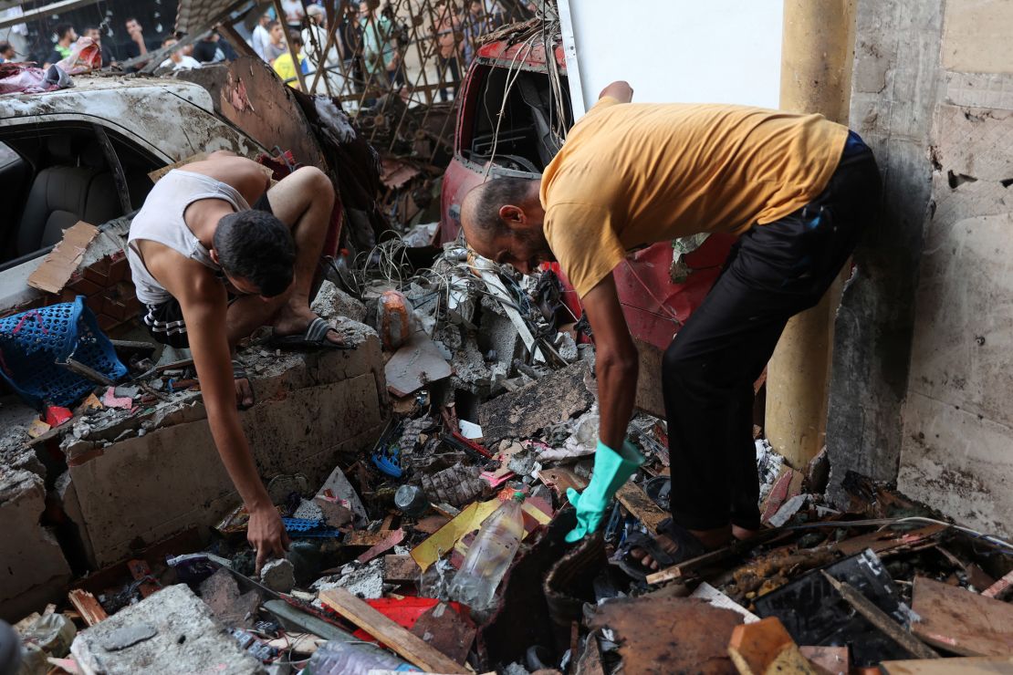 People sift through the rubble inside a Gaza school struck by the IDF on August 10, 2024.