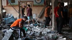 People check the damage inside a school used as a temporary shelter for displaced Palestinians in Gaza City, following an Israeli strike on August 10, 2024, that killed more than 90 people amid the ongoing conflict between Israel and Hamas militants. (Photo by Omar AL-QATTAA / AFP) (Photo by OMAR AL-QATTAA/AFP via Getty Images)