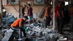 People check the damage inside a school, which was being used as a temporary shelter for displaced Palestinians, in Gaza City, following an Israeli strike on August 10, 2024. (Photo by Omar AL-QATTAA / AFP) (Photo by OMAR AL-QATTAA/AFP via Getty Images)