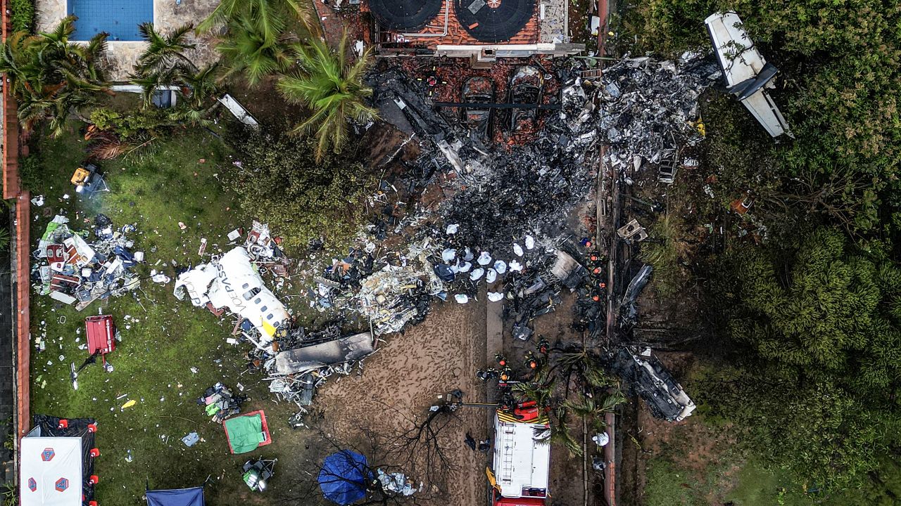 TOPSHOT - This photo shows an aerial view of the wreckage of an airplane that crashed with 61 people on board in Vinhedo, Sao Paulo State, Brazil, on August 10, 2024. An airplane carrying 57 passengers and four crew crashed on August 9 in Brazil's Sao Paulo state, killing everyone on board, the airline said. The aircraft, an ATR 72-500 operated by Voepass airline, was traveling from Cascavel in southern Parana state to Sao Paulo's Guarulhos international airport when it crashed in the city of Vinhedo. (Photo by Nelson ALMEIDA / AFP) (Photo by NELSON ALMEIDA/AFP via Getty Images)