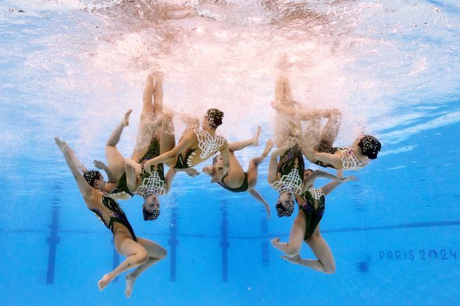 Artistic swimmers from Japan perform their acrobatic routine on August 7.