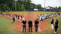 GREENVILLE, NORTH CAROLINA - AUGUST 07:  Team Kilfoil and Team McQuillin starters stand for the national anthem with Little League World Series players during an Athletes Unlimited Pro game at Max R. Joyner Family Stadium on August 07, 2024 in Greenville, North Carolina. (Photo by Grant Halverson/Getty Images)