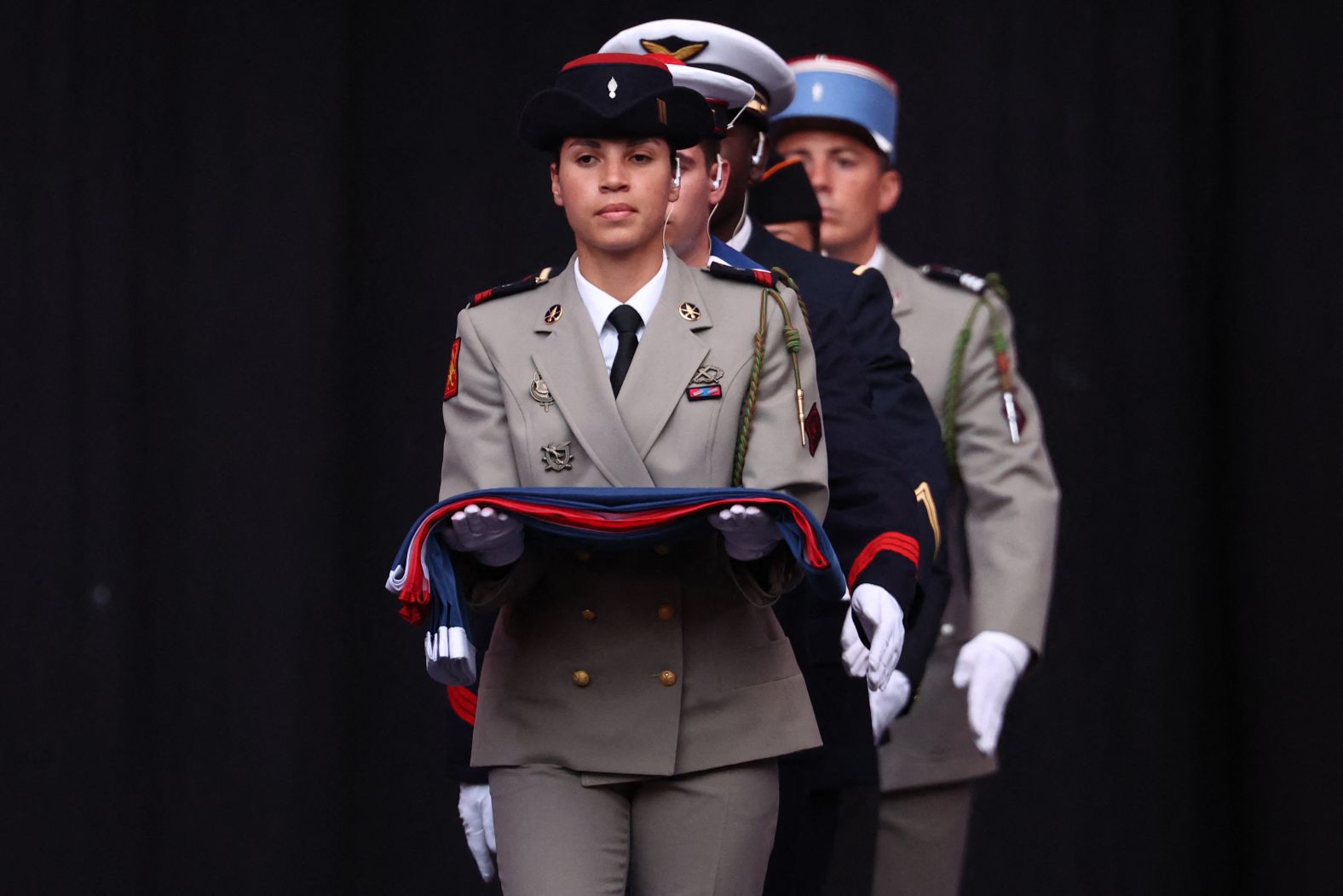 France's national flag is carried into the stadium at the start of the ceremony.