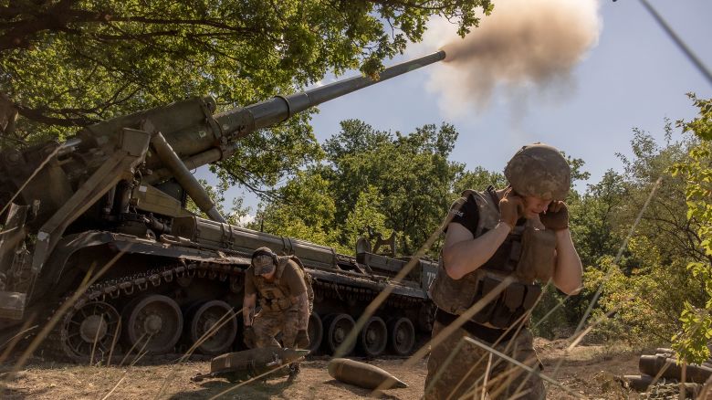  Ukrainian servicemen fire artillery toward Russian positions in an undisclosed area in the Pokrovsk district of Ukraine.