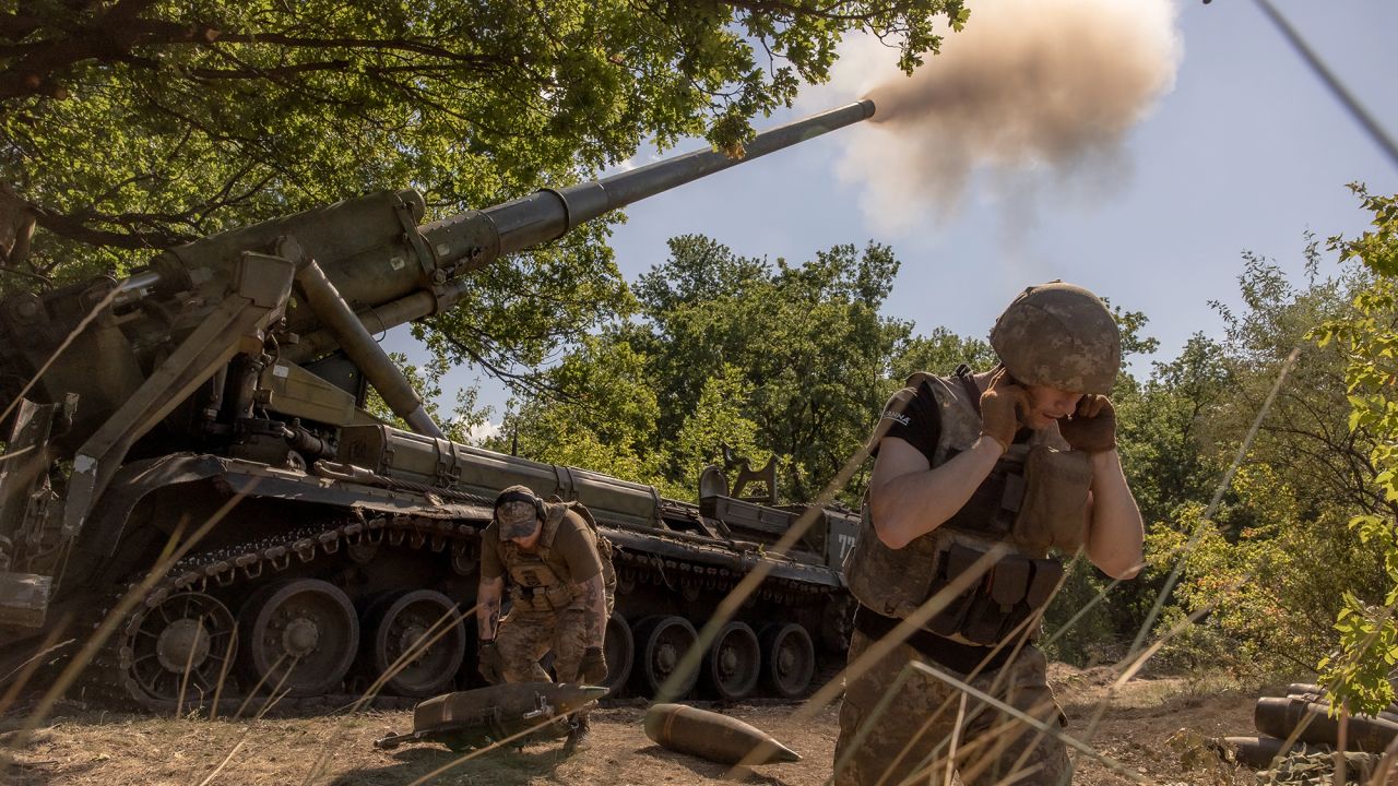  Ukrainian servicemen fire artillery toward Russian positions in an undisclosed area in the Pokrovsk district of Ukraine.