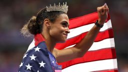 PARIS, FRANCE - AUGUST 08: Sydney McLaughlin-Levrone of Team United States celebrates winning the gold medal with the new World Record by wearing a crown after competing in the Women's 400m Hurdles Final on day thirteen of the Olympic Games Paris 2024 at Stade de France on August 08, 2024 in Paris, France. (Photo by Cameron Spencer/Getty Images)