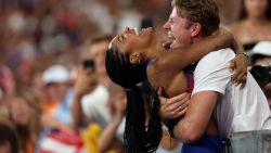 PARIS, FRANCE - AUGUST 08: Tara Davis-Woodhall of Team United States celebrates with her husband Hunter Woodhall after winning the gold medal in the Women's Long Jump Final on day thirteen of the Olympic Games Paris 2024 at Stade de France on August 08, 2024 in Paris, France. (Photo by Patrick Smith/Getty Images)