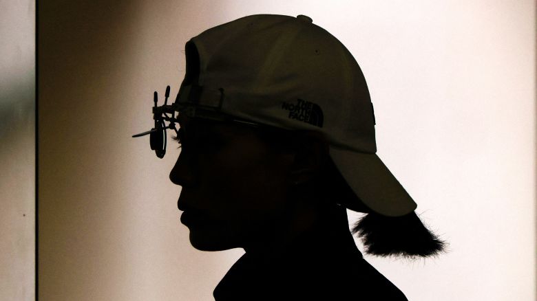 South Korea's Kim Yeji is silhouetted as she competes during the women's 25m pistol qualification during the Paris 2024 Olympic Games at Chateauroux Shooting Centre on August 2, 2024.