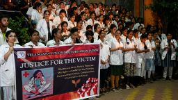 Junior doctors protest the rape and murder of a young medic from Kolkata, during a candle light demonstration at the Gandhi Hospital in Hyderabad on August 12, 2024.