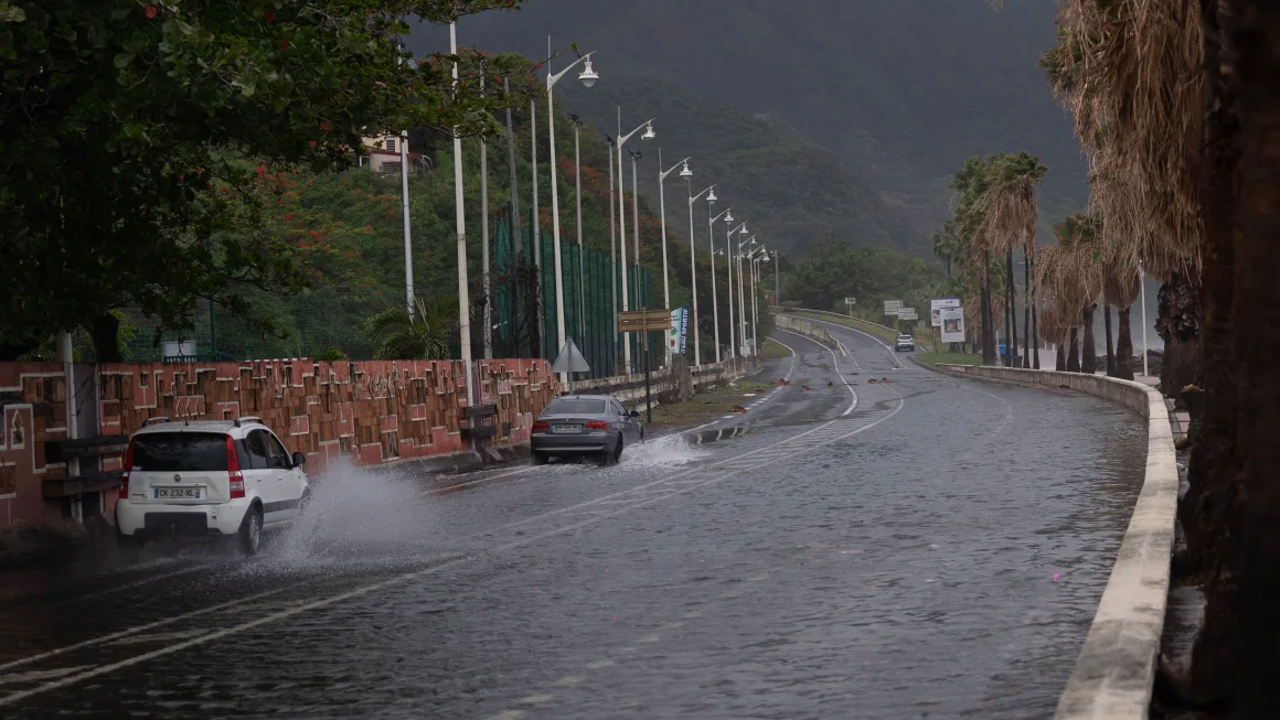 Tropical Storm Ernesto nears hurricane strength as it skirts Puerto Rico, bringing concerns of floods and power outages