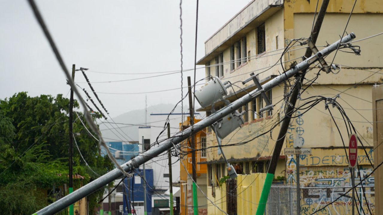 Downed power lines are seen after Tropical Storm Ernesto moved through the area in Fajardo, Puerto Rico, on August 14, 2024. On August 13, Ernesto advanced through the Caribbean toward Puerto Rico, where officials shut down schools and sent workers home as forecasters warned of a possible hurricane. The storm was moving west toward the US island with maximum sustained winds of 50 miles per hour (85kph), according to the National Hurricane Center. (Photo by Jaydee Lee SERRANO / AFP) (Photo by JAYDEE LEE SERRANO/AFP via Getty Images)