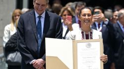 Mexican president-elect Claudia Sheinbaum (R), next to her husband Jesús Maria Tarriba, shows the certificate of her victory in the past June 2 presidential election at the Electoral Tribunal of the Federal Judiciary (TEPJF), in Mexico City on August 15, 2024. Mexico's electoral court unanimously proclaimed president-elect Claudia Sheinbaum -with 59.7 per cent of the vote, after resolving a series of challenges filed by the opposition. Sheinbaum who will assume next October 1st. (Photo by Alfredo ESTRELLA / AFP) (Photo by ALFREDO ESTRELLA/AFP via Getty Images)