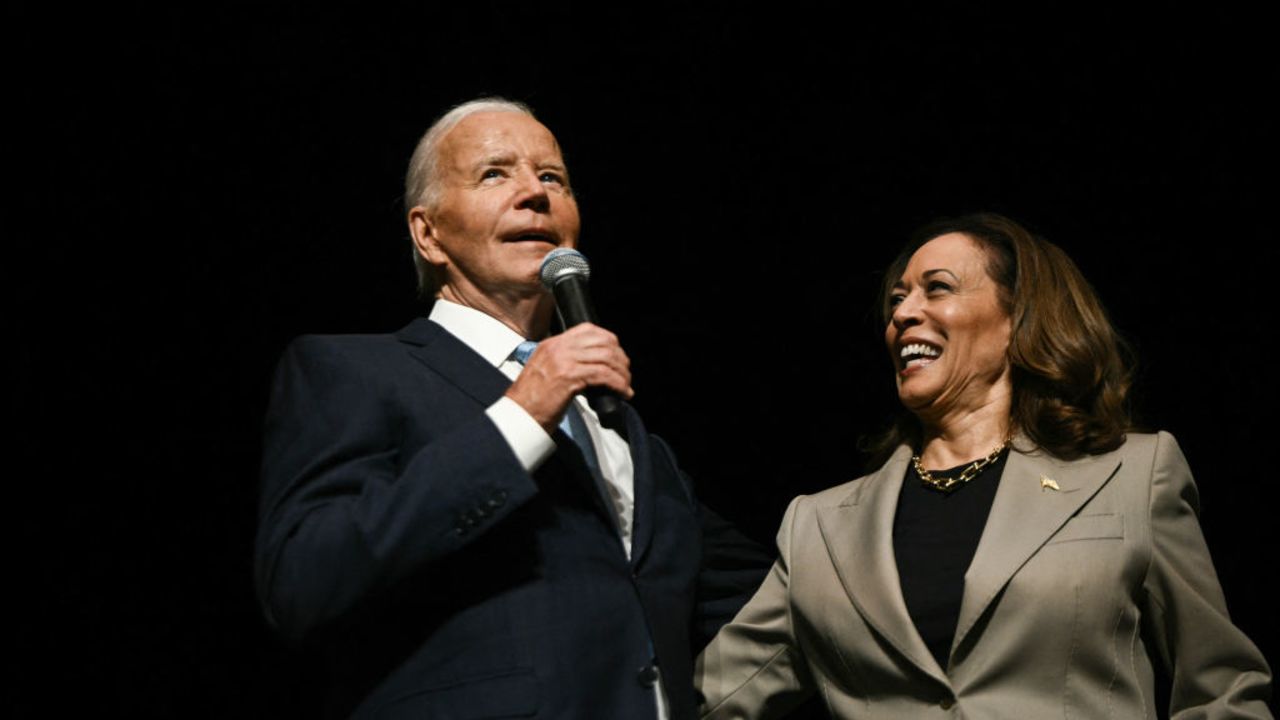 US Vice President and Democratic presidential candidate Kamala Harris looks on as President Joe Biden speaks in the overflow room at Prince George's Community College in Largo, Maryland, on August 15, 2024. (Photo by Brendan SMIALOWSKI / AFP) (Photo by BRENDAN SMIALOWSKI/AFP via Getty Images)