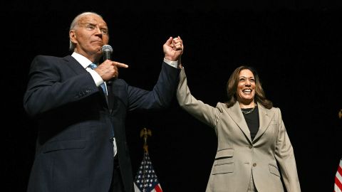 President Joe Biden points to Vice President and Democratic presidential candidate Kamala Harris after they spoke at Prince George's Community College in Largo, Maryland, on August 15, 2024.